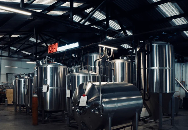 Exterior view of LA BRU brewery, showcasing its vibrant and welcoming architecture that reflects Mexican culture, with an emphasis on tradition and craftsmanship in beer production.